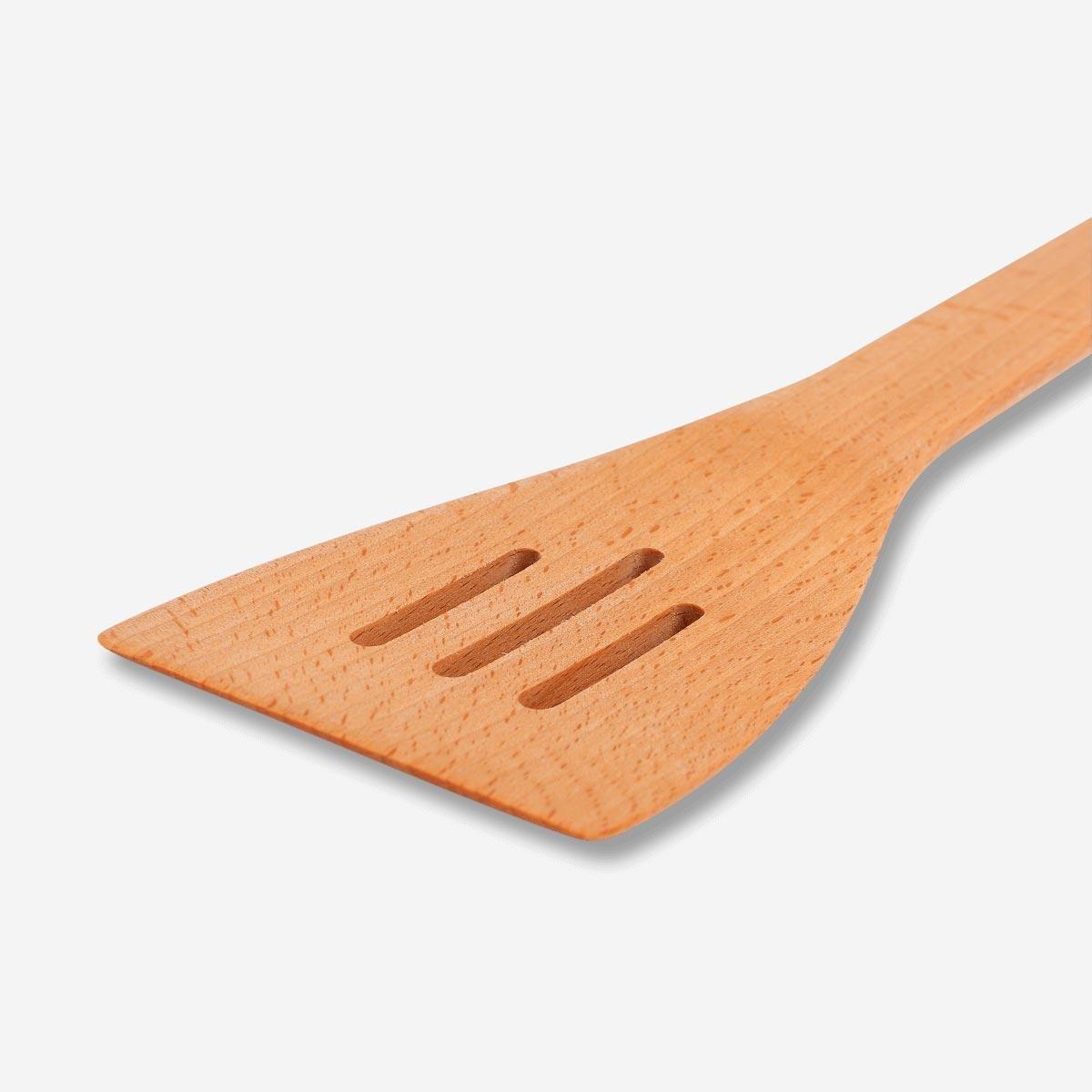Brown wooden slotted spatula