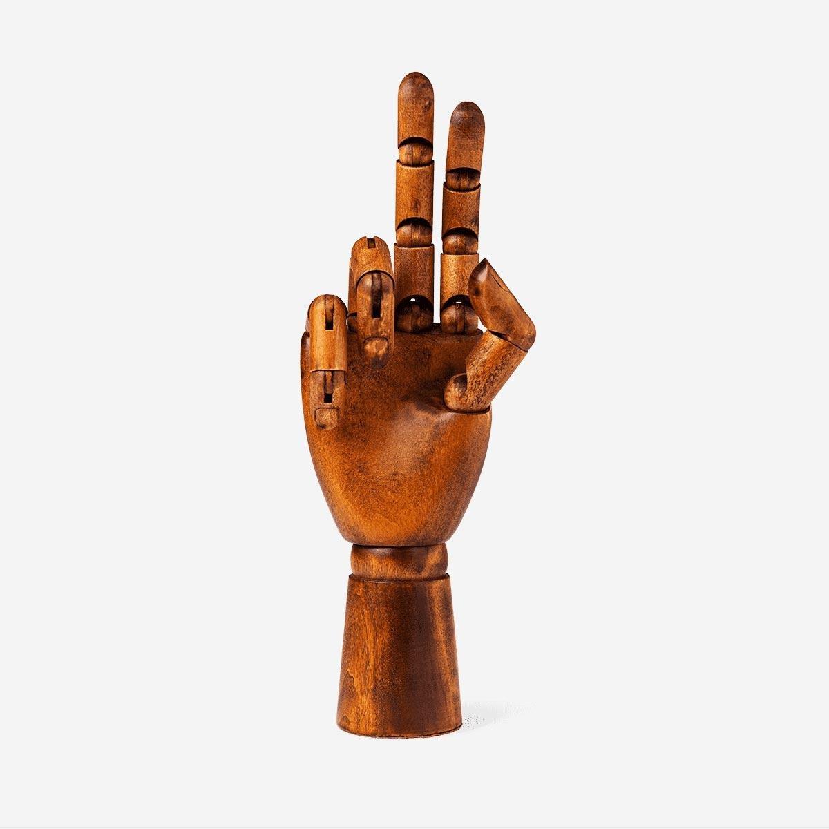 Brown wooden croquis hand