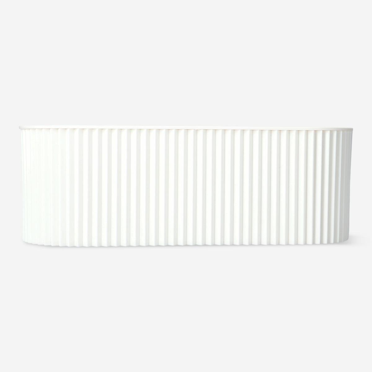 White ribbed plastic box cable hider