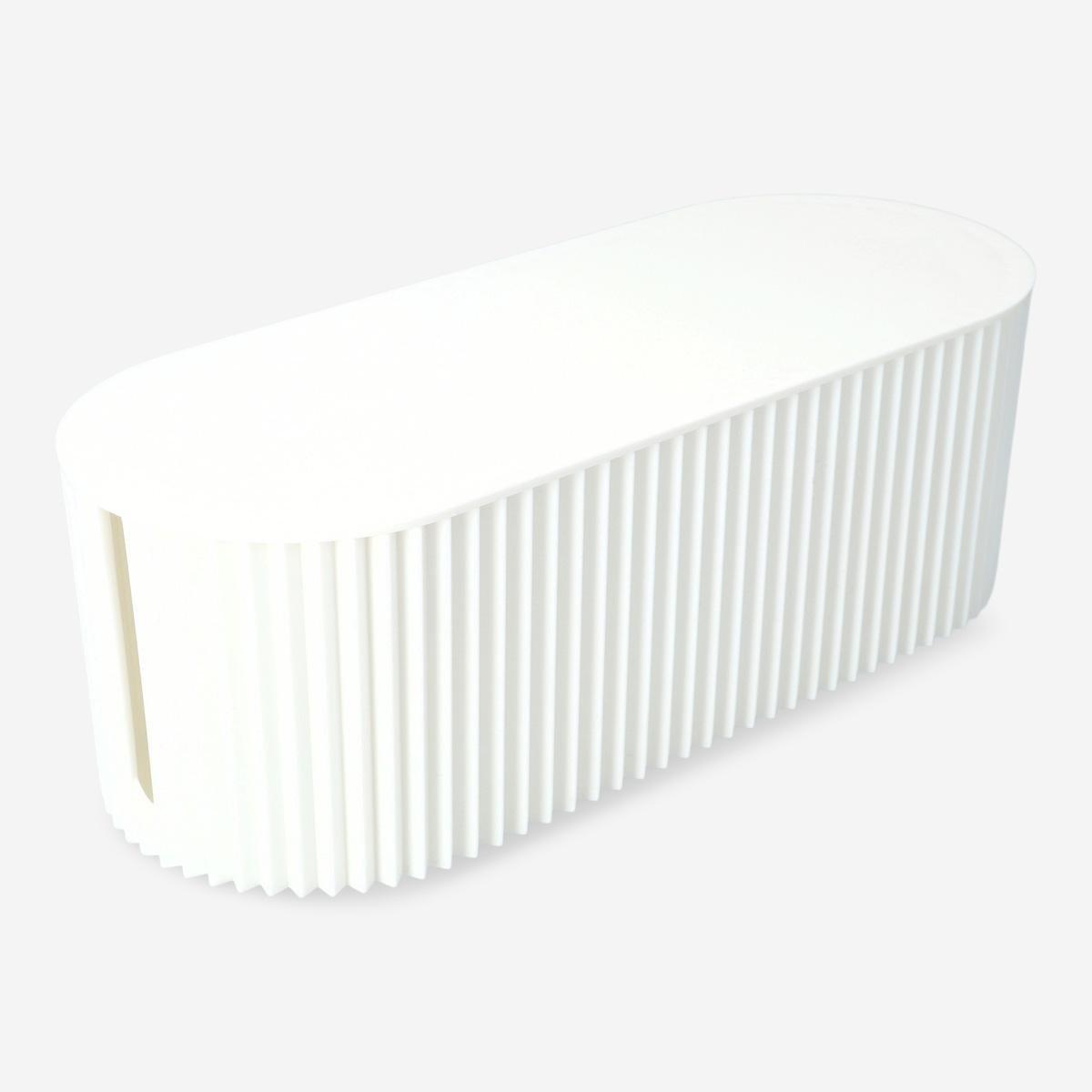 White ribbed plastic box cable hider