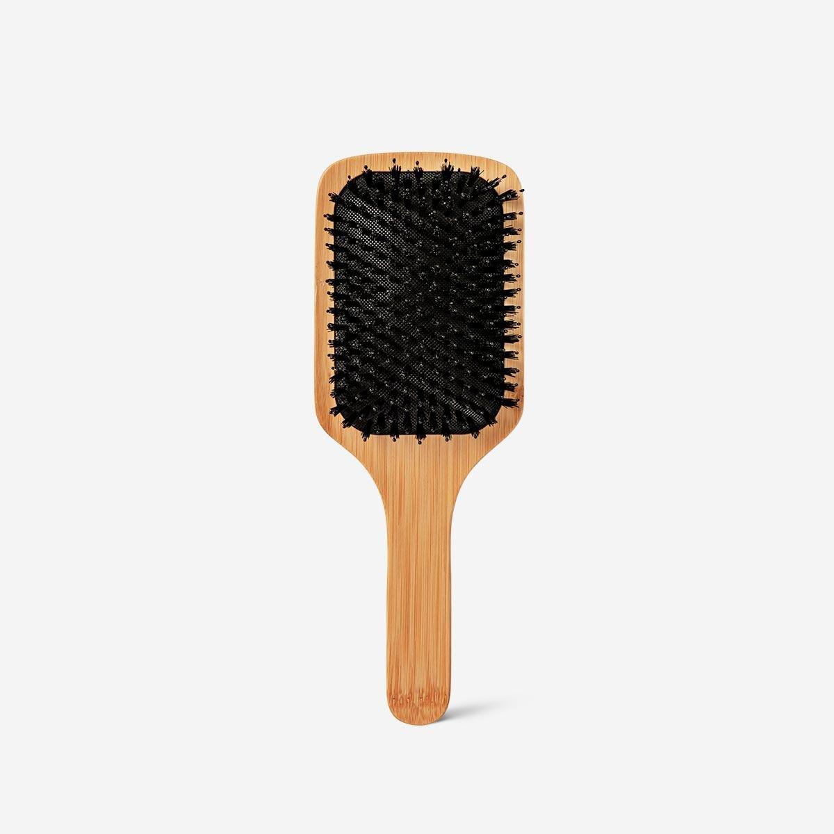 Beige Wooden hairbrush. paddle