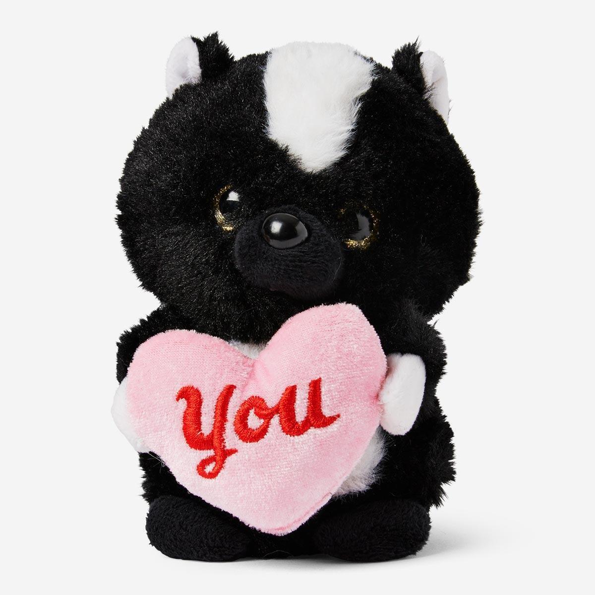 Black teddy bear with heart