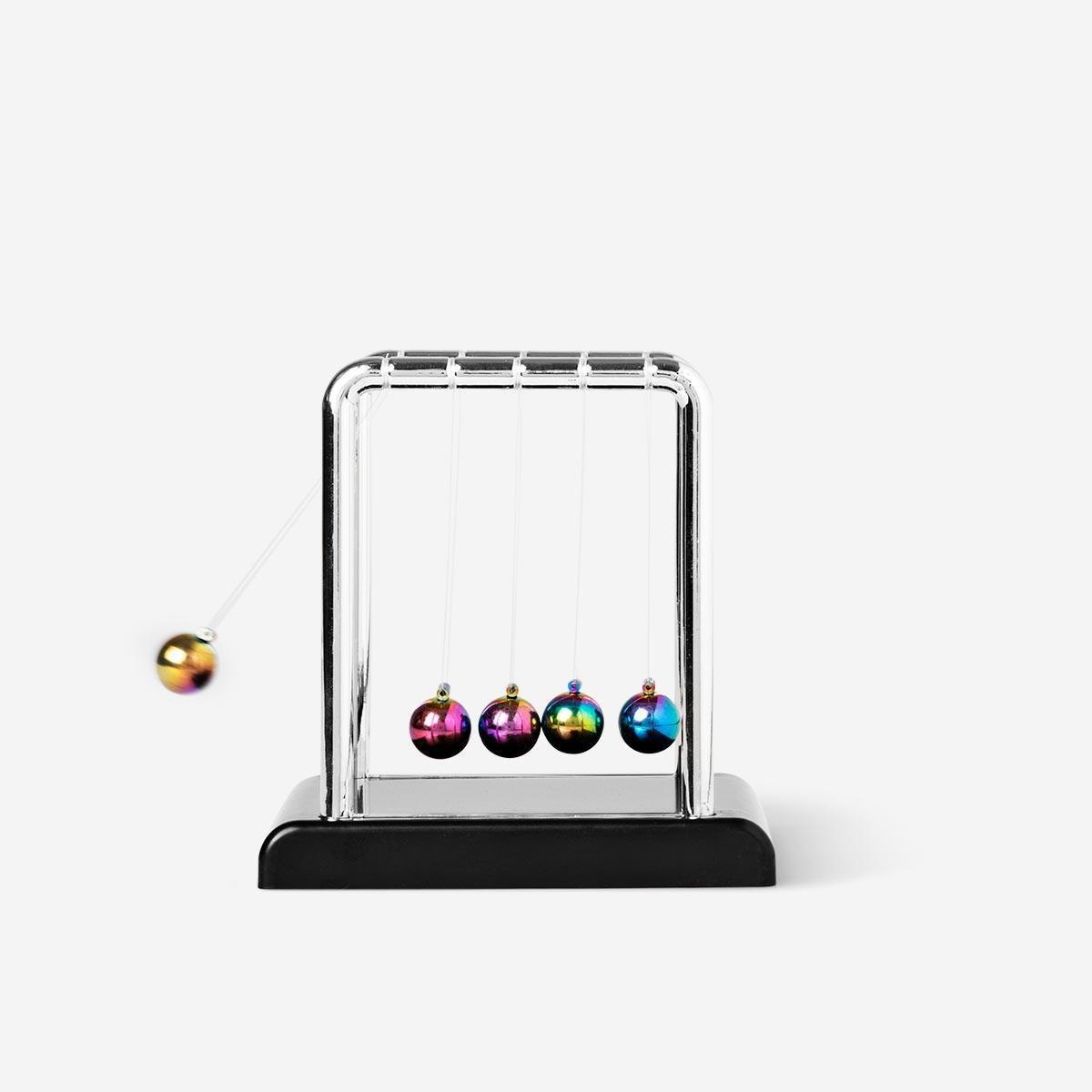 Multicolour swinging newtons cradle