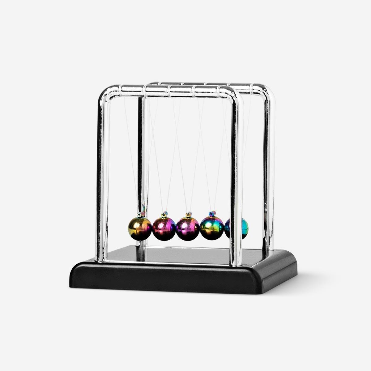 Multicolour swinging newtons cradle
