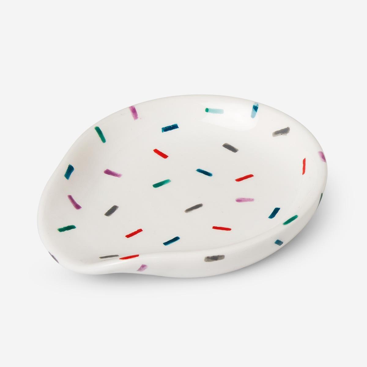 White ceramic spoon holder