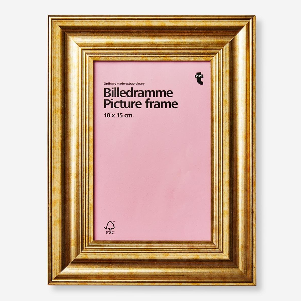 Gold picture frame. 10 x 15 cm