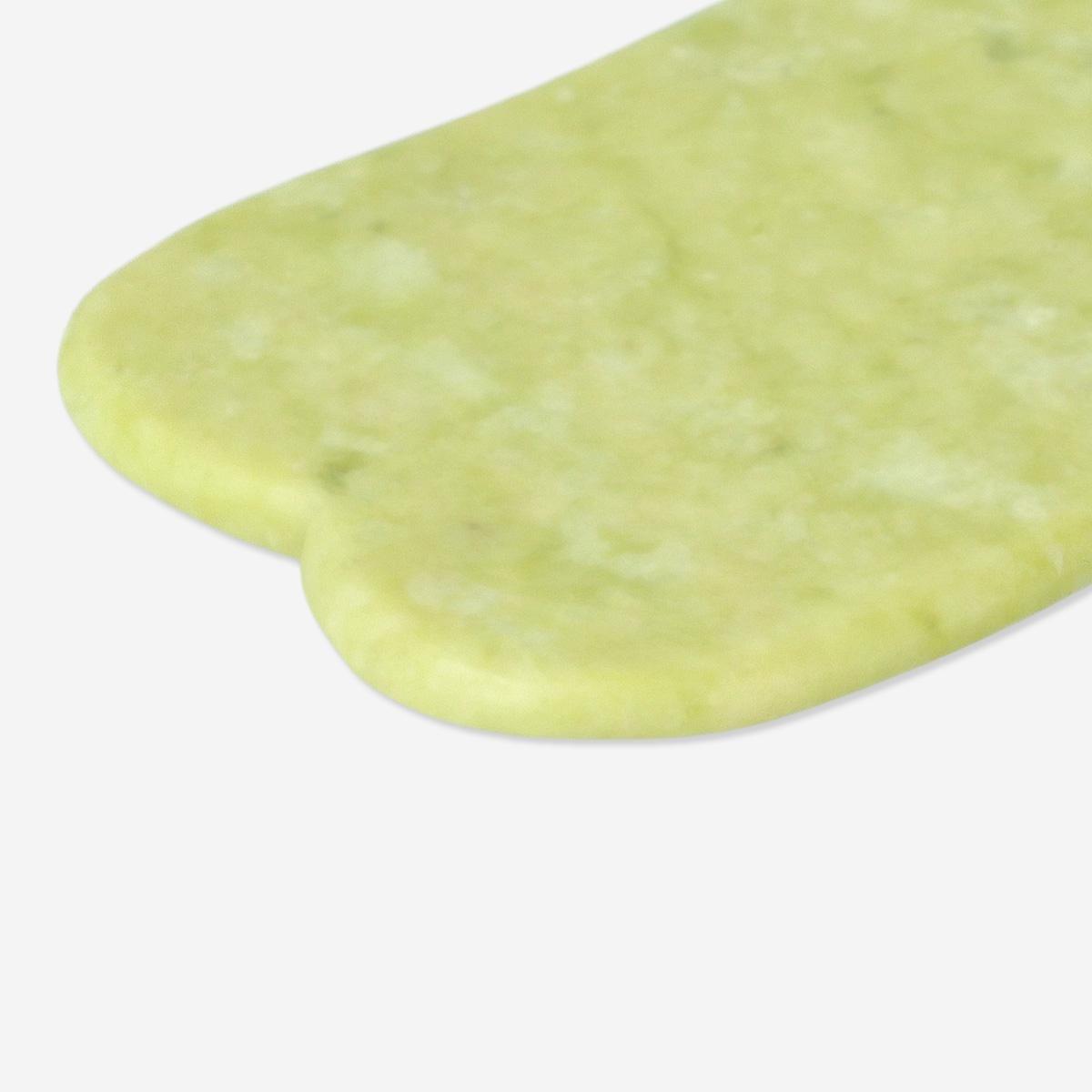 Green gua sha tool. natural stone
