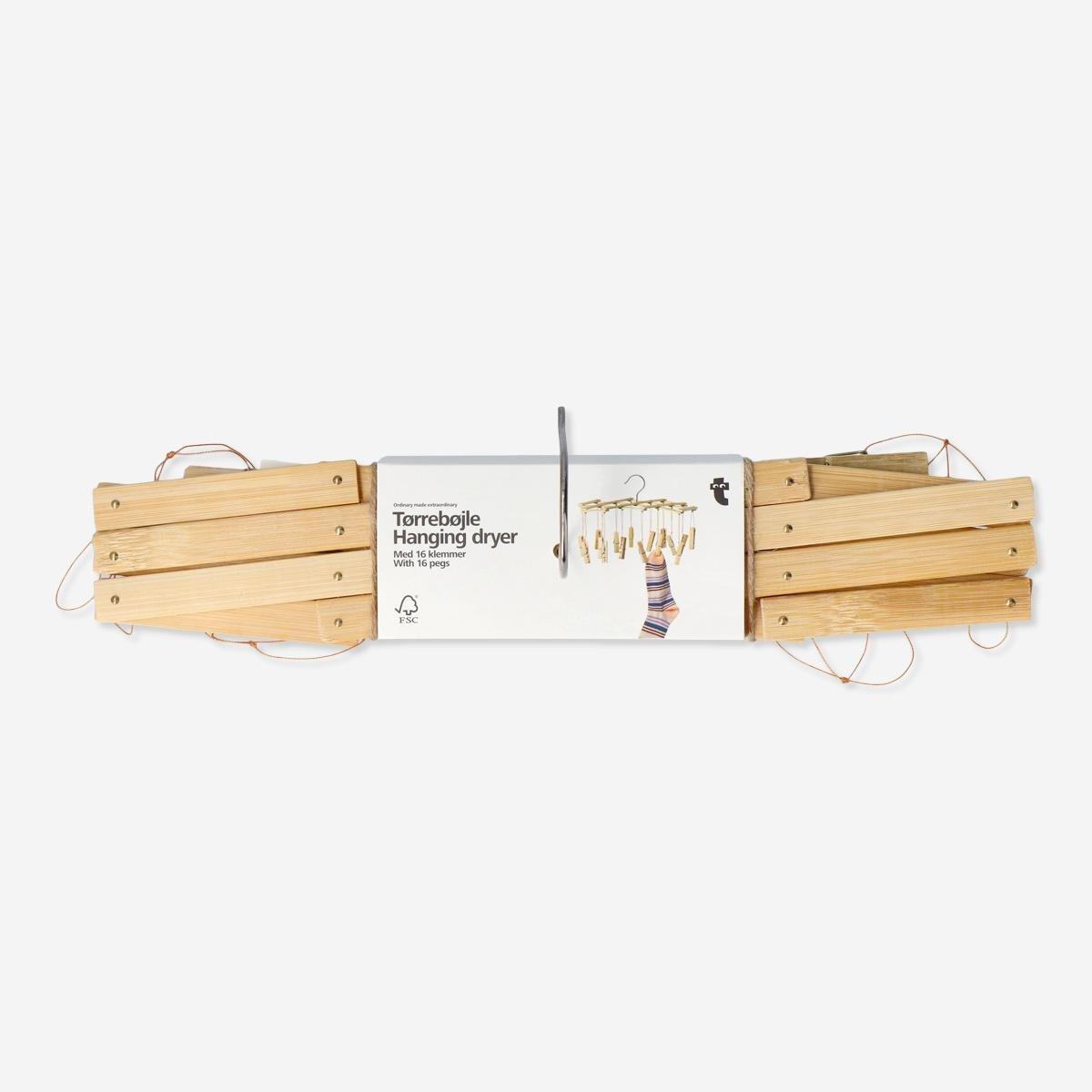 Beige hanging dryer with pegs