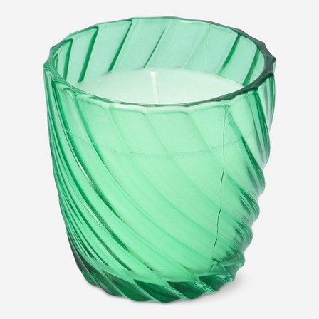 Green candle in glass