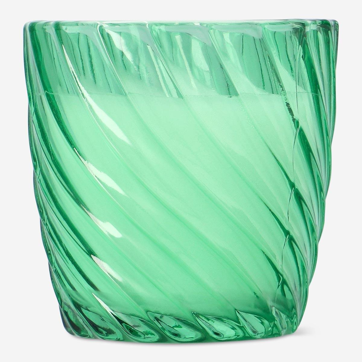 Green candle in glass