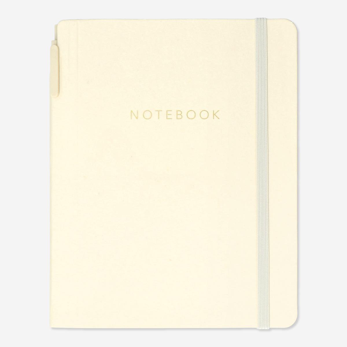 Yellow notebook with ballpoint pen