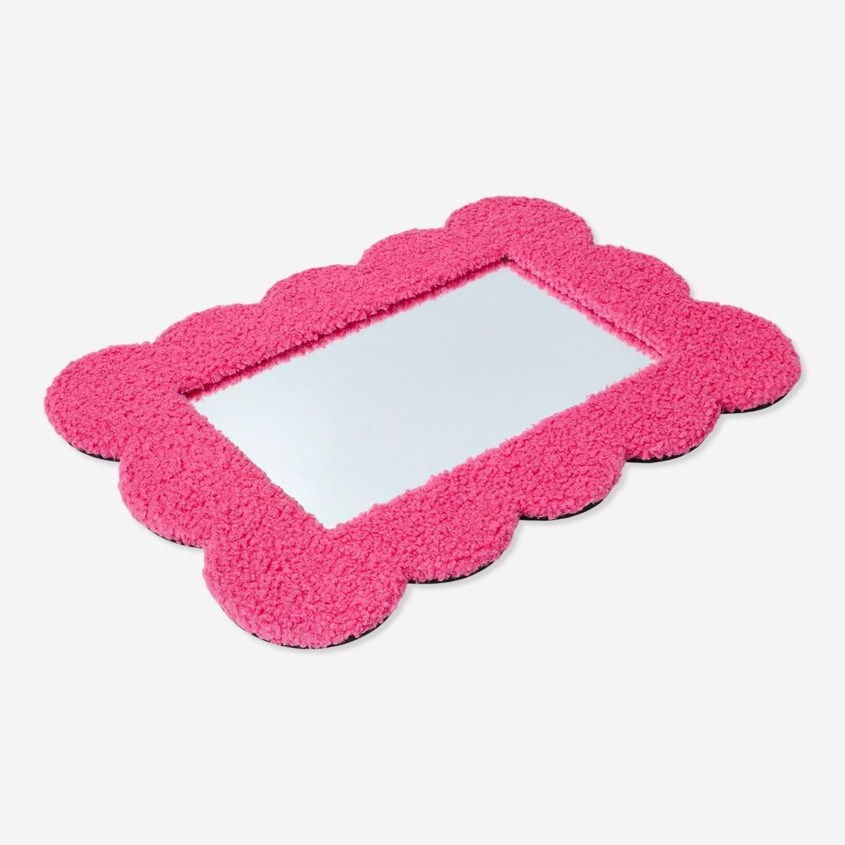 Pink curved-edge mirror