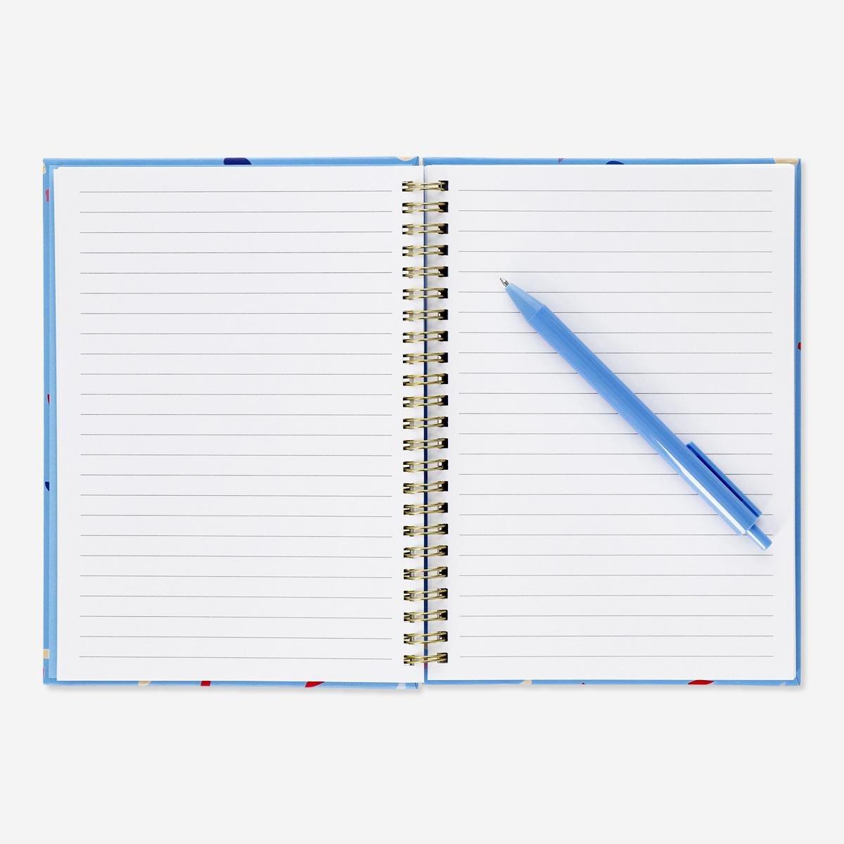 Blue notebook with writing utensils. a5