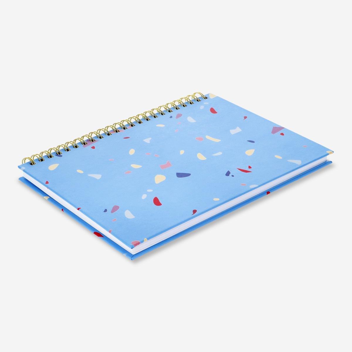 Blue notebook with writing utensils. a5