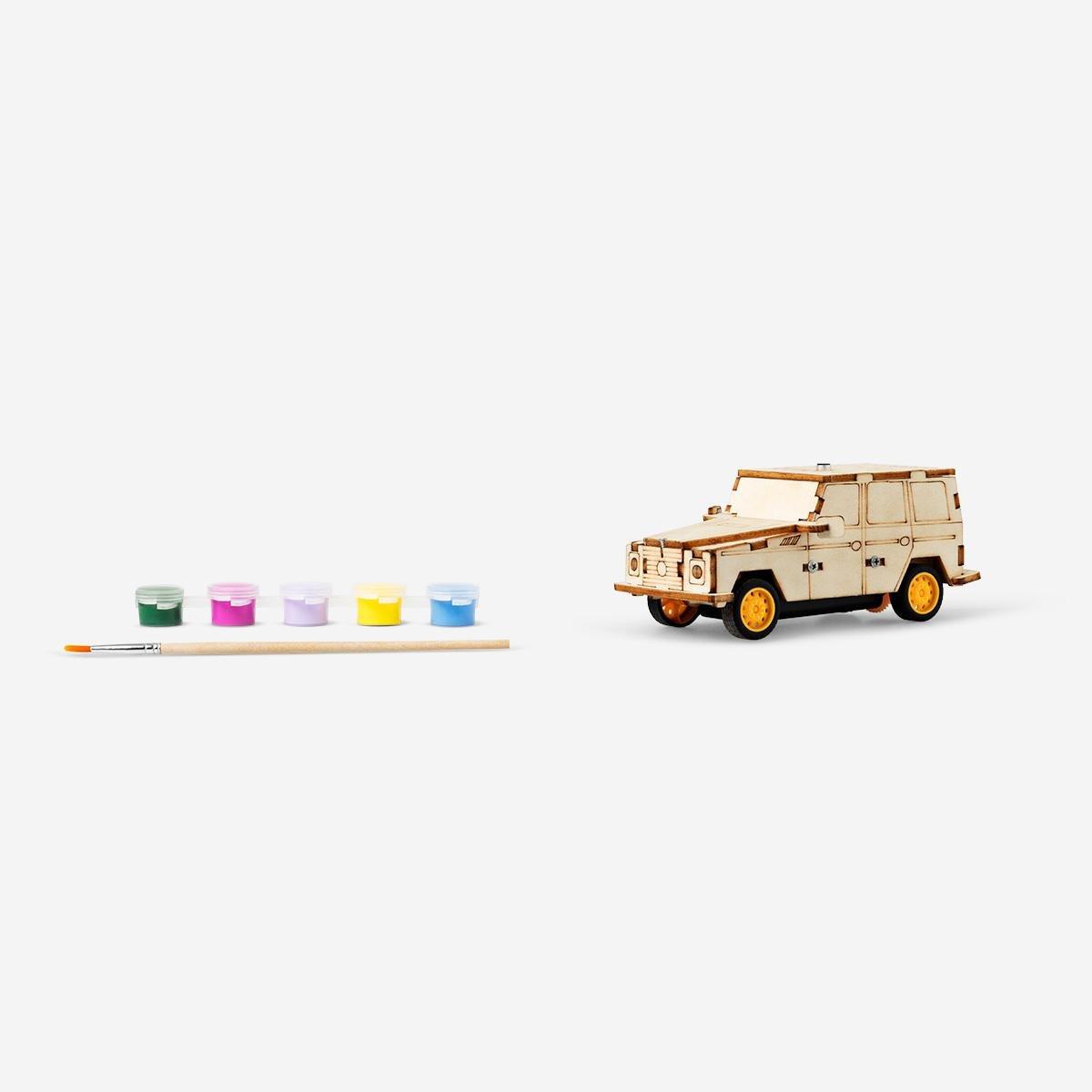 Brown wooden paint-your-own car. drives when you clap