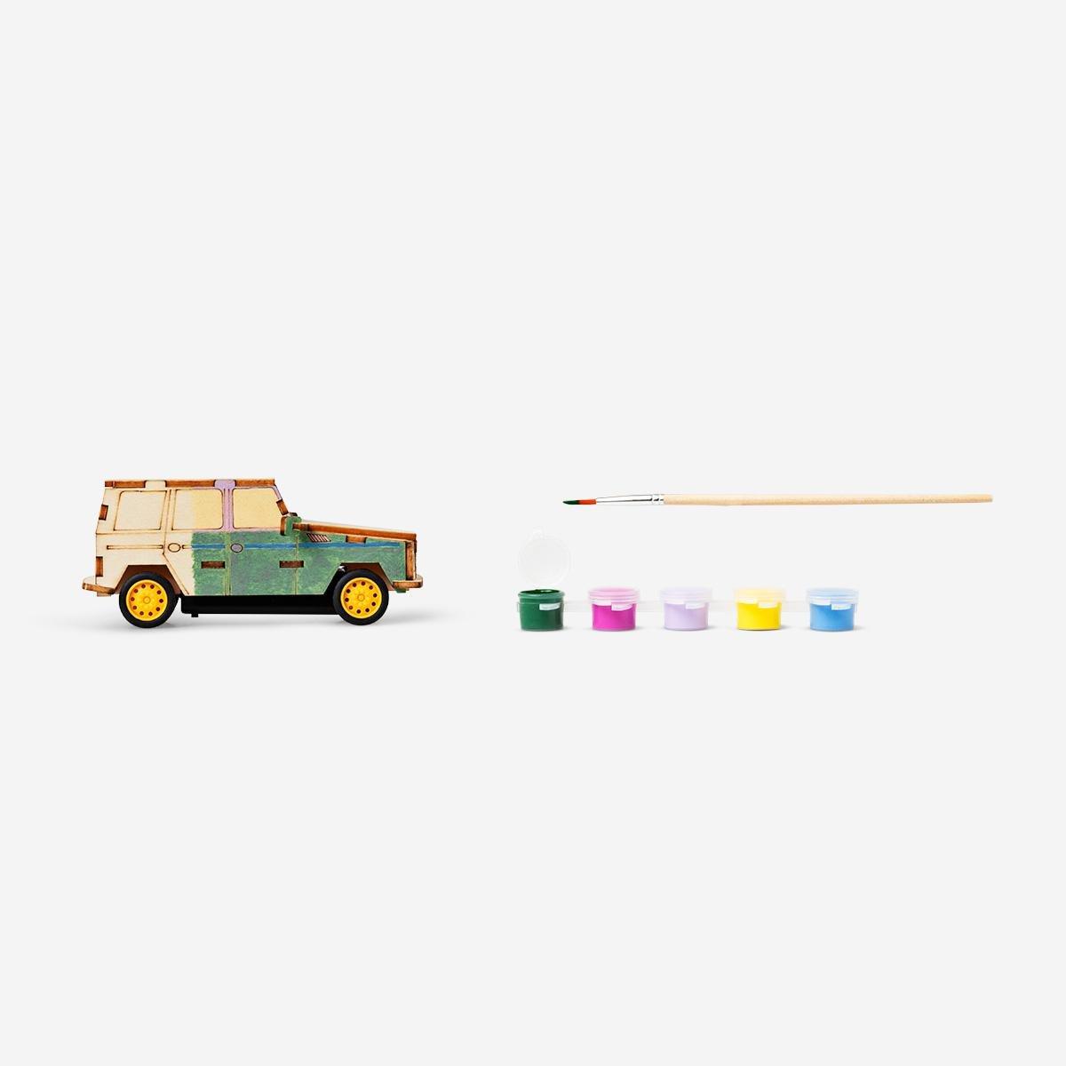 Brown wooden paint-your-own car. drives when you clap