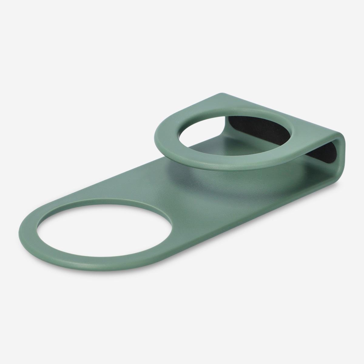 Green wall socket phone holder
