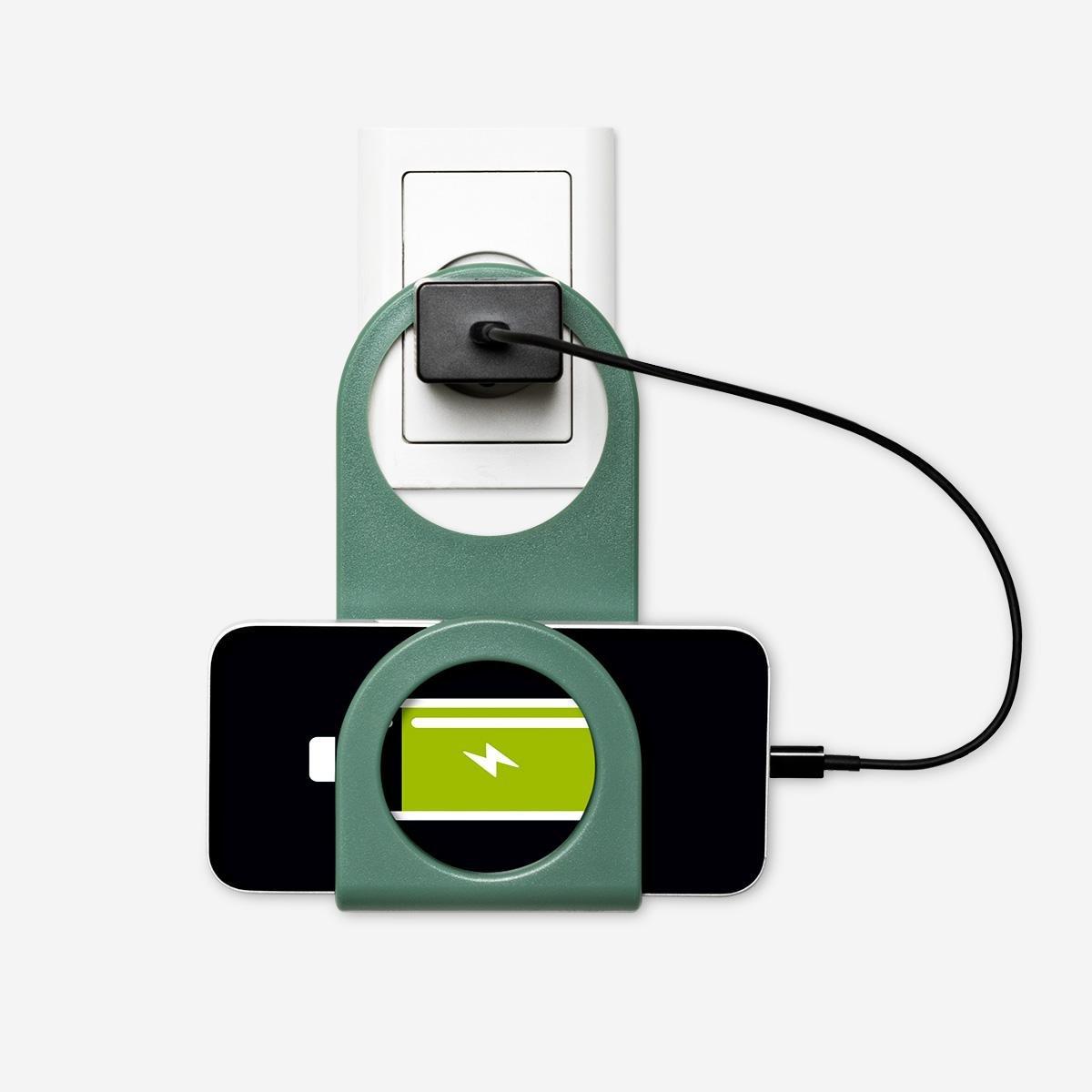 Green wall socket phone holder