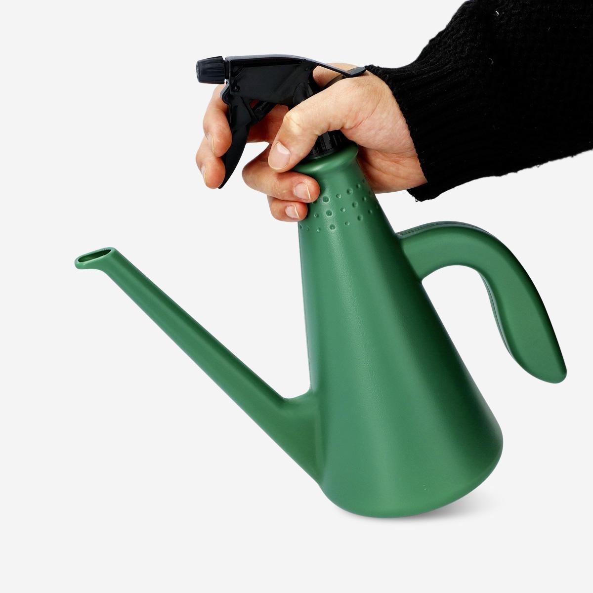 Green watering can. with mist spray