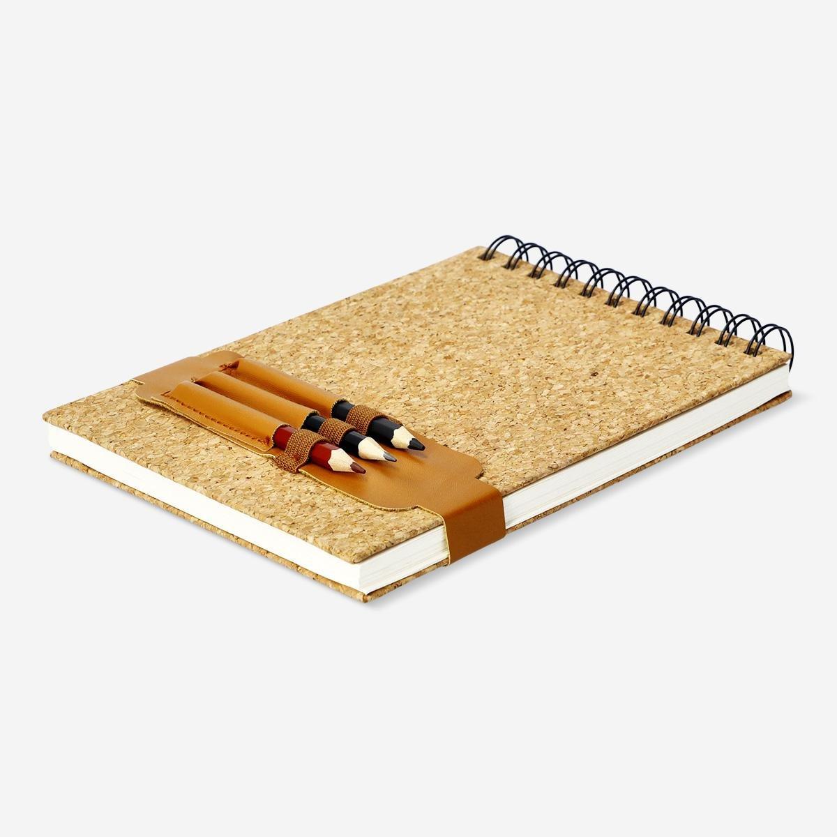 Brown sketchbook with pencils. a5