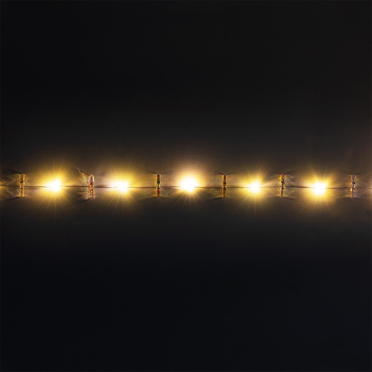 White illuminate string lights. 220 cm
