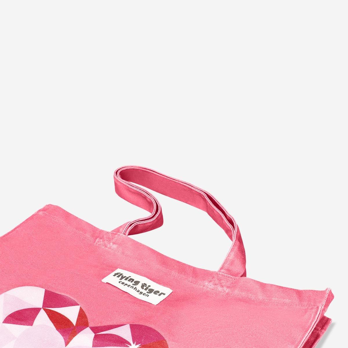 Pink tote bag with drawstring closure