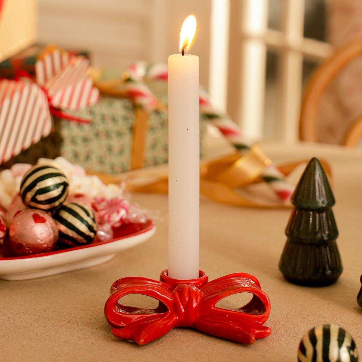 Red bow shaped candle holder