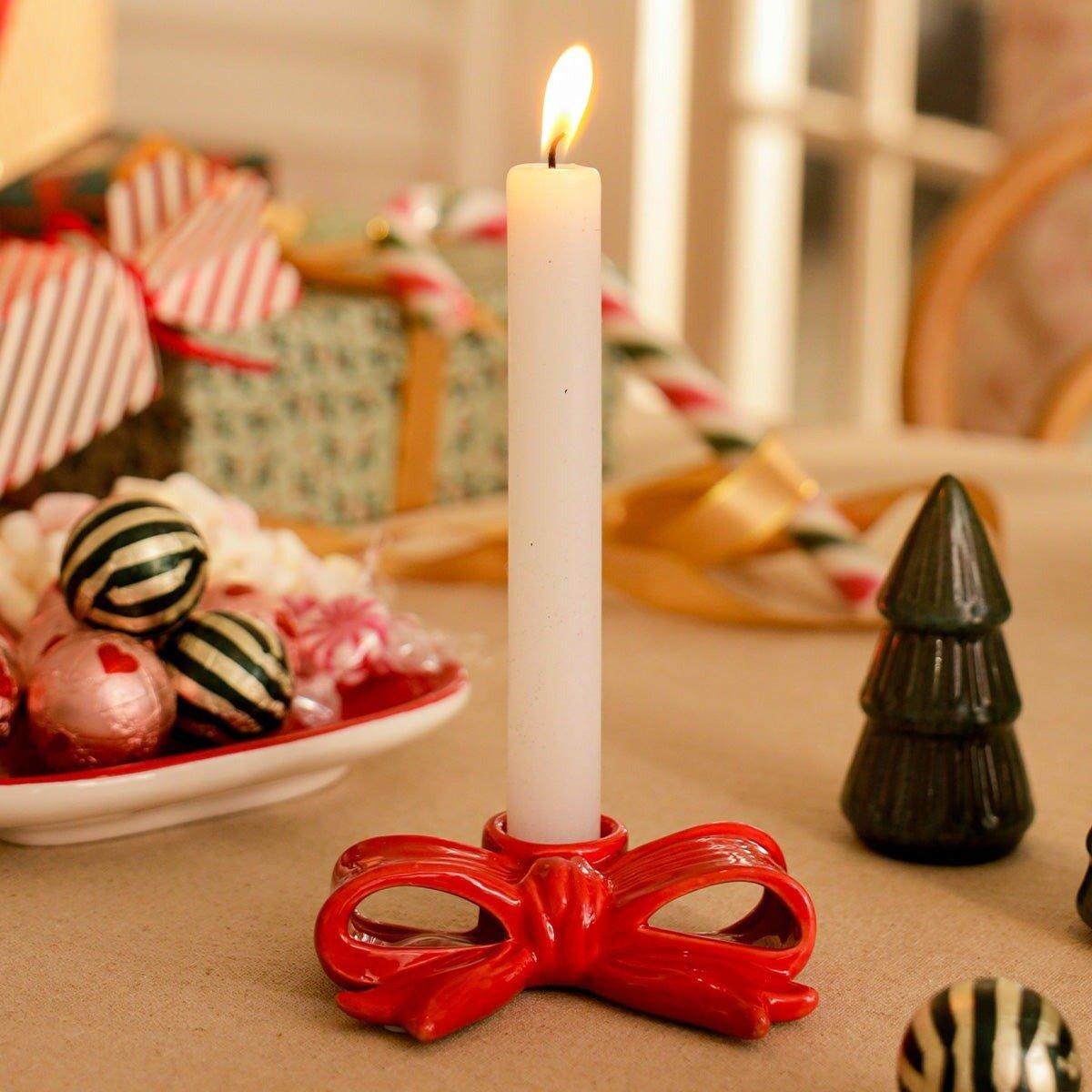 Red bow shaped candle holder