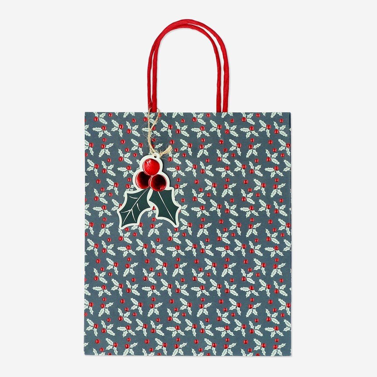 Multicolour gift bag with debossed holly pattern