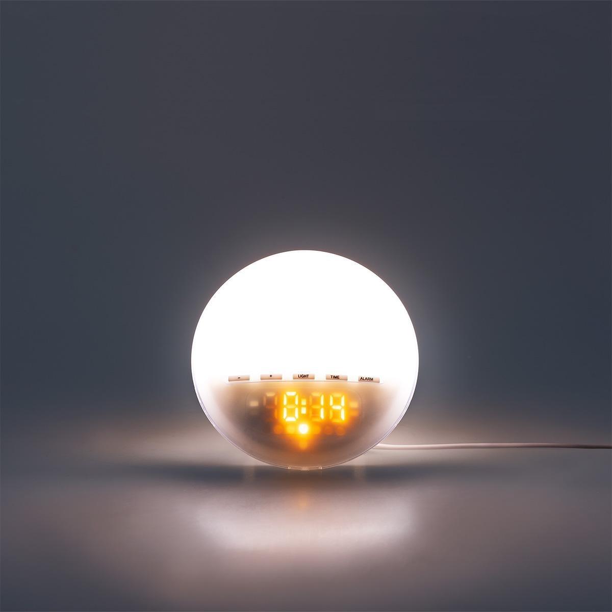 White digital alarm clock with sunrise light