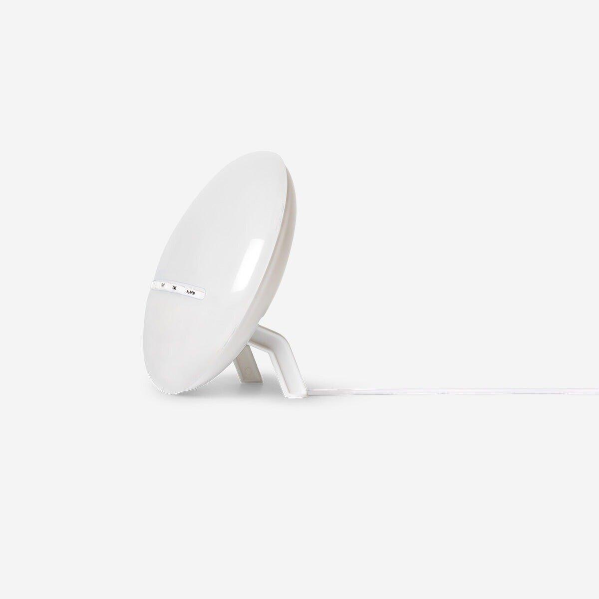 White digital alarm clock with sunrise light