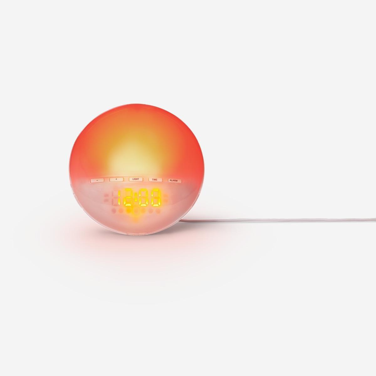 White digital alarm clock with sunrise light