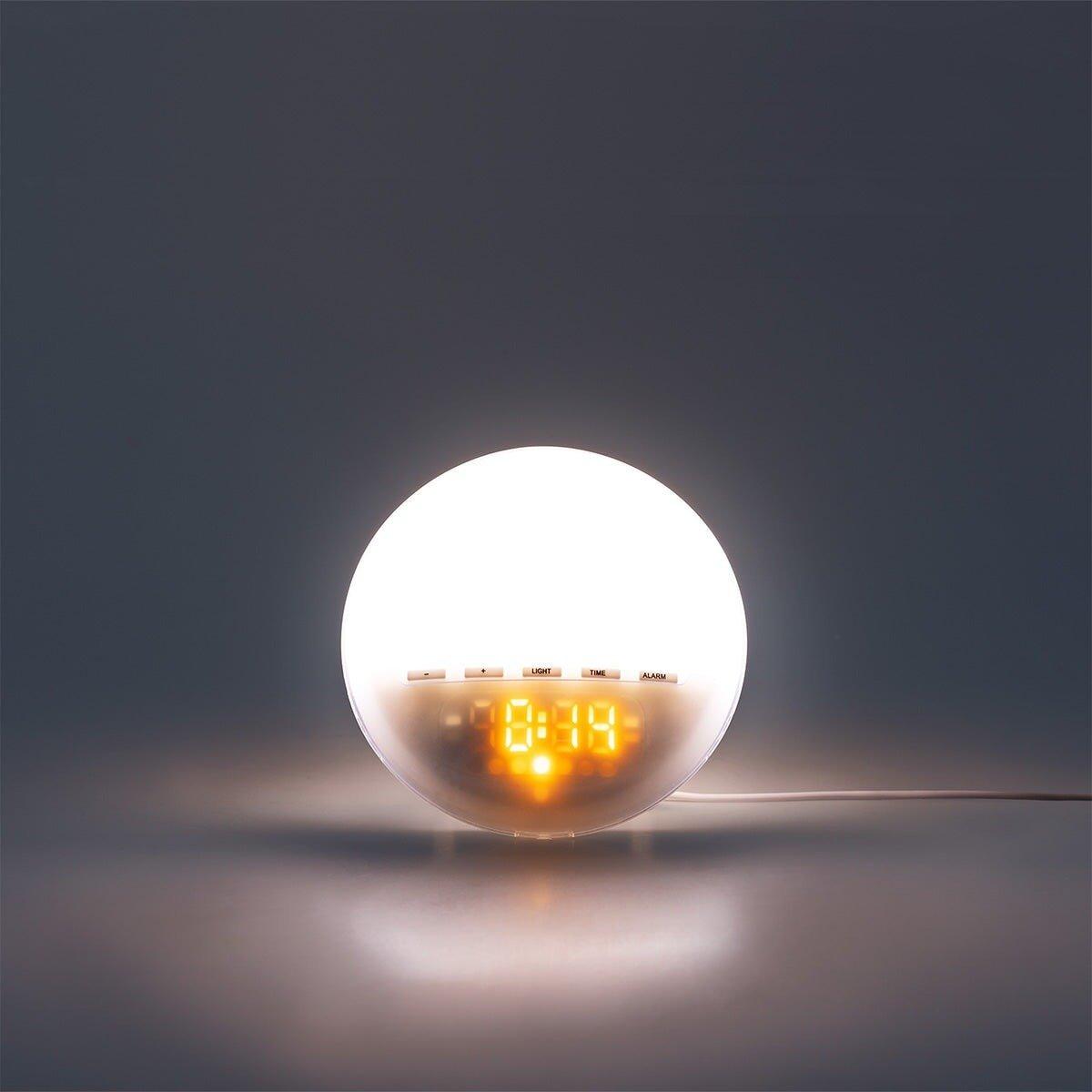 White digital alarm clock with sunrise light