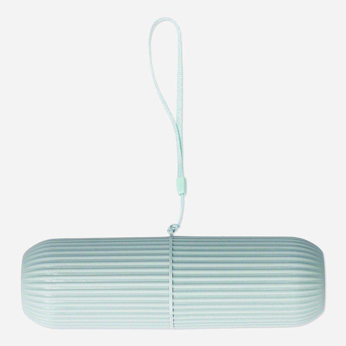 Green travel case for toothbrush