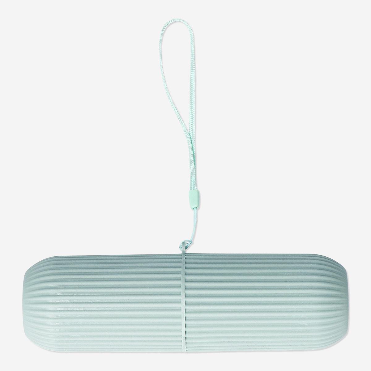 Green travel case for toothbrush