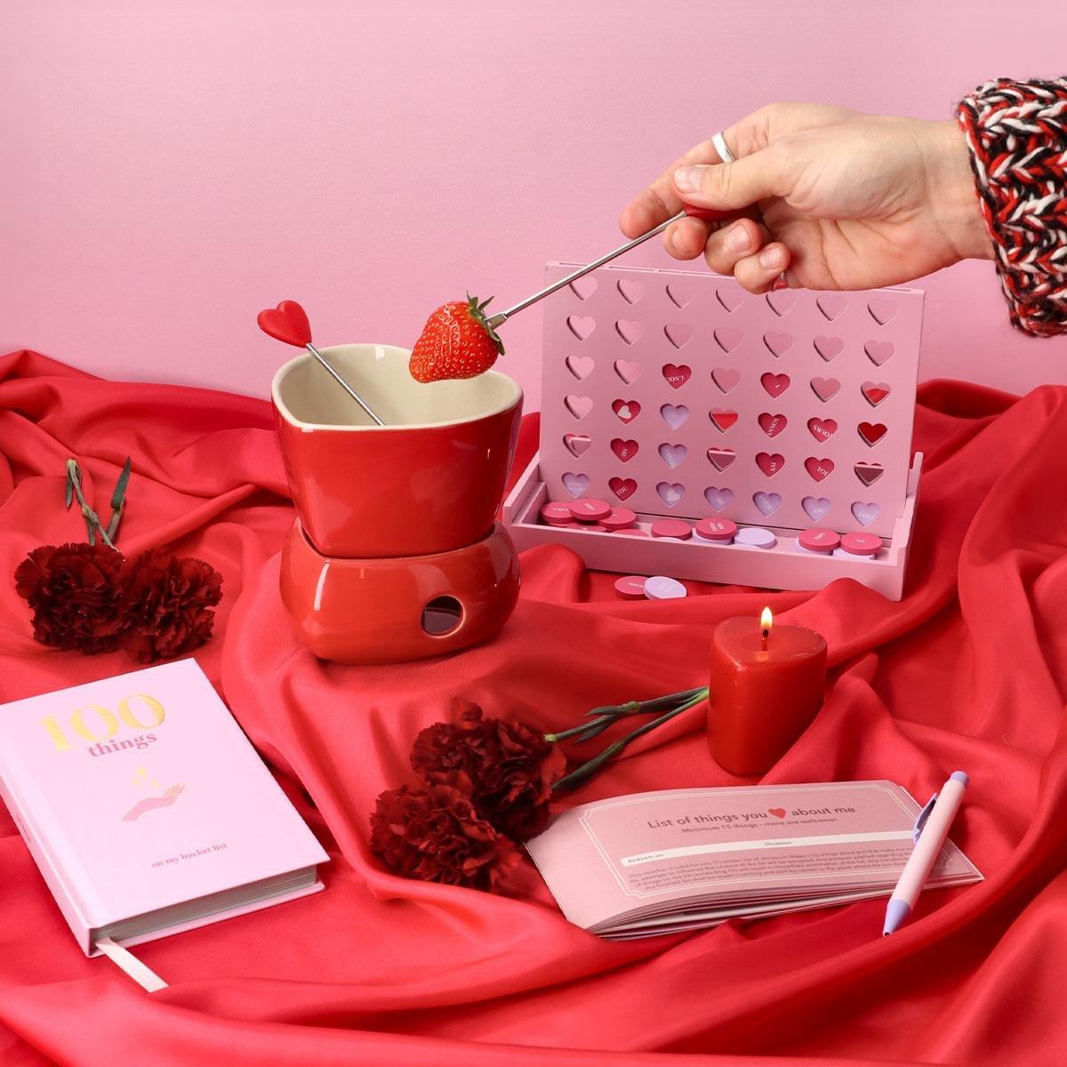Red chocolate fondue set with 2 forks